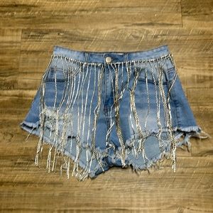 Tried on never worn rhinestone shorts. Excellent condition.